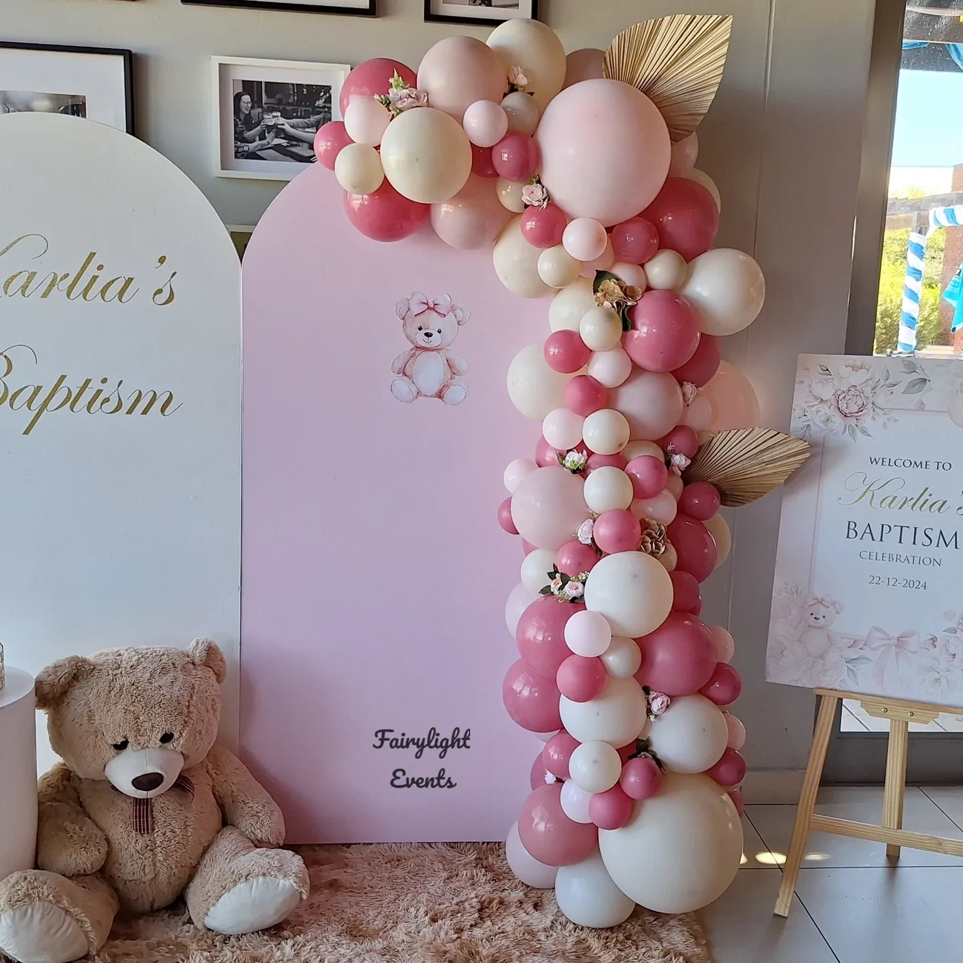 Pink balloon garland baptism backdrop