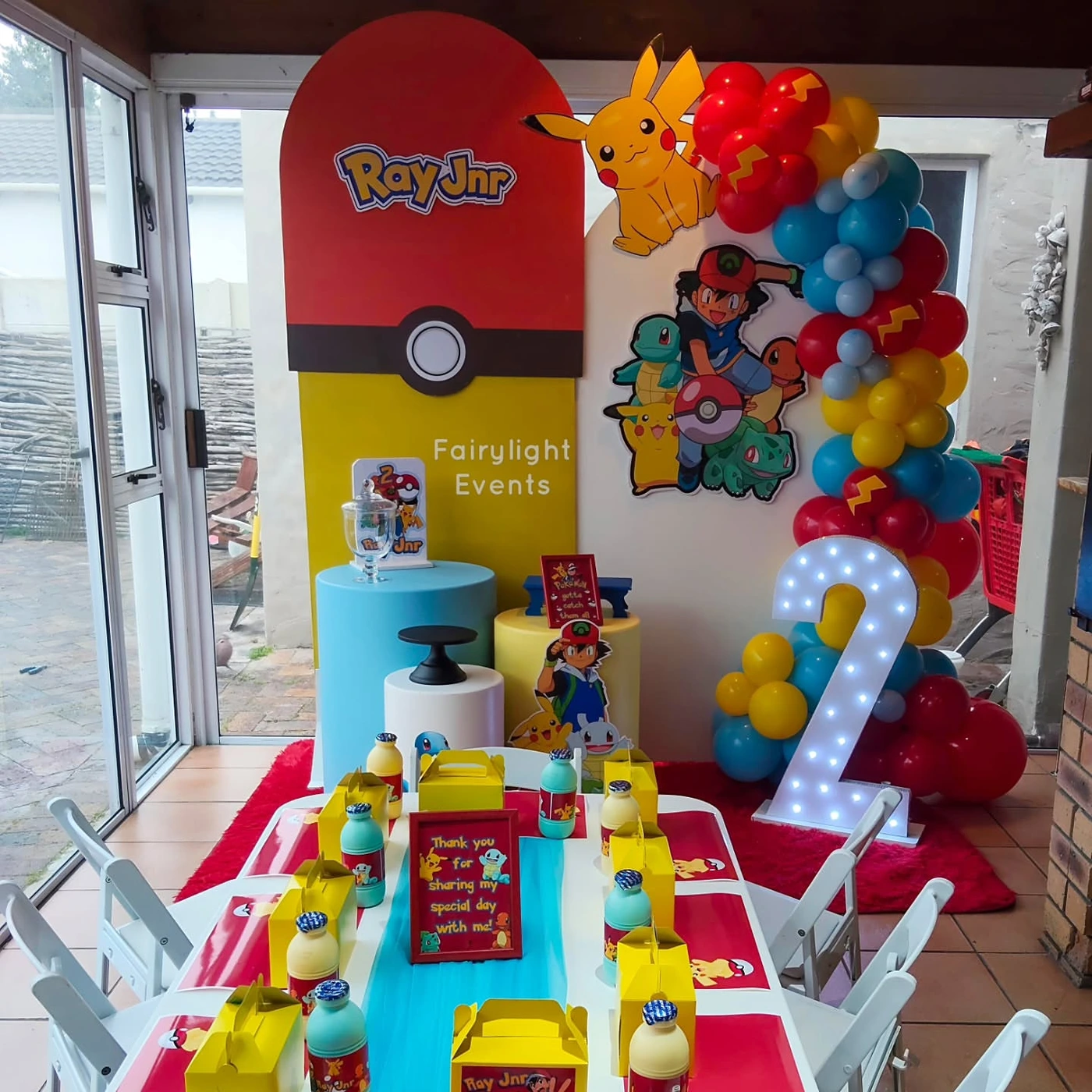 Pokemon themed birthday backdrop and balloon garland